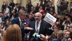 Activist Forcibly Removed Prior to Trump-Putin Press Conference