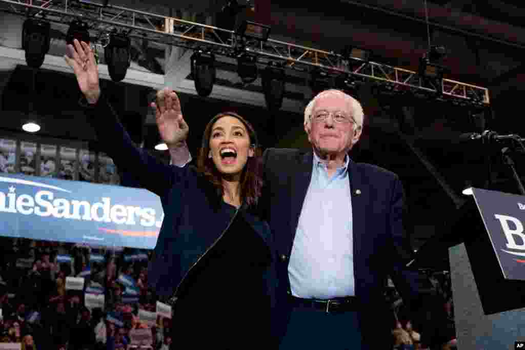 Democratic presidential candidate Sen. Bernie Sanders, right, and Rep. Alexandria Ocasio-Cortez campaign in Durham, N.H.