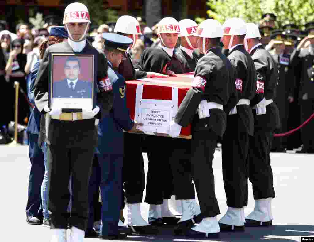 Members of media give live reports across from St. Mary's Hospital exclusive Lindo Wing in London, July 22, 2013.