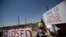 Activists hold a protest against the treatment and conditions of children in immigration detention outside U.S. Customs and Border Protection's Border Patrol station facilities in Clint, Texas