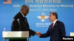 U.S. Secretary of Defense Lloyd Austin shakes hands with South Korean Defense Minister Lee Jong-sup after a joint press conference at the Defense Ministry in Seoul, South Korea Jan. 31, 2023.