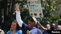 Demonstrators attend a rally to protest the police shooting of Stephon Clark, in Sacramento, Calif., March 31, 2018. 