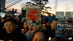 Exiled Tibetans participate in a candlelight vigil in Dharamshala, India, Jan. 8, 2025, in solidarity with the victims of an earthquake that hit a high-altitude Tibet region in western China the day before.