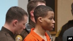 FILE - Lee Boyd Malvo listens to court proceedings during the trial of fellow sniper suspect John Allen Muhammad in Virginia Beach, Va., Oct. 20, 2003.