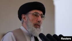 FILE - Afghan warlord Gulbuddin Hekmatyar speaks at the presidential palace in Kabul, Afghanistan, May 4, 2017. 