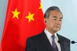 FILE - Chinese Foreign Minister Wang Yi attends a press conference in Beijing, Aug. 21, 2019.