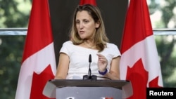 FILE - Canadian Foreign Minister Chrystia Freeland takes part in a news conference at the Embassy of Canada in Washington, Aug. 31, 2018. 