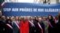 Clichy la Garenne's mayor Remi Muzueau, center right, and President of the Regional Council of the Ile-de-France region Valerie Pecresse, center left, demonstrate against Muslim street prayers, in the Paris suburb of Clichy la Garenne, Friday, Nov. 10, 2017. Clichy Muslims had been renting a prayer hall from City Hall, but the town's mayor decided to turn that space into a library. The dispute reflects nationwide problems with mosque shortages.