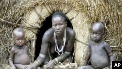 An Omo woman and her children outside their home on the banks of Ethiopia’s Omo River