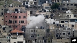 Smoke rises from an ongoing Israeli military operation in the West Bank Nur Shams refugee camp, Feb. 12, 2025. 