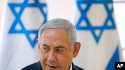 Israeli Prime Minister Benjamin Netanyahu chairs during the weekly Cabinet meeting being held in the Jordan Valley, in the Israeli-occupied West Bank, Sept. 15, 2019.