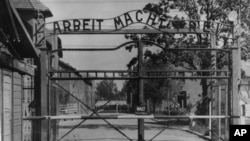 FILE - This undated photo shows the main gate of the Nazi concentration camp Auschwitz, in Poland, which was liberated by the Russians in January 1945.