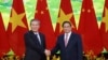 Chinese Premier Li Qiang, left, and Vietnamese Prime Minister Pham Minh Chinh shake hands before a meeting in Hanoi, Oct. 13, 2024. (Duong Van Giang/VNA via AP)