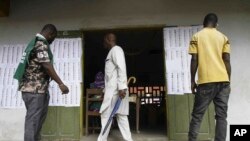 FILE - Malians living in the Ivory Coast, gather at a polling station before casting their ballot on a new Malian draft constitution, in Abidjan, Sunday, June 18, 2023.
