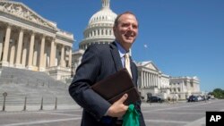 FILE - Rep. Adam Schiff, D-Calif., Chairman of the House Intelligence Committee, walks across the plaza on Capitol Hill in Washington.