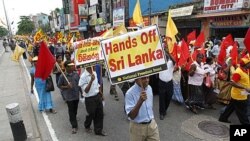 Thousands of flag-waving Sri Lankans used a May Day rally Sunday to protest a UN report on alleged crimes committed during the country's civil war, Colombo, May 1, 2011