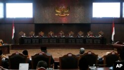 Judges preside over the final hearing on the court challenge to the results of April's presidential election at the Constitutional Court in Jakarta, Indonesia, Thursday, June 27, 2019.