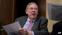 FILE - Sen. Johnny Isakson, R-Ga., meets with his staff in his office on Capitol Hill in Washington, Dec. 2, 2019. 