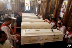   Caskets of murdered Coptic Christians are seen during their funeral service at the Church of the Grand Prince Martyr Tadros, Minya, Egypt, November 3, 2018. 