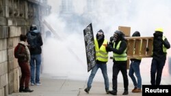 Protesters attend a demonstration of the yellow vest movement in Nantes, France, Jan. 12, 2019.