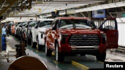 FILE: Tundra trucks and Sequoia SUV's exit the assembly line as finished products at Toyota's truck plant in San Antonio, Texas, on April 17, 2023. 