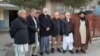 In this photo provided to VOA by Hasina Jalal, her father Faizullah Jalal, an Afghan professor (3rd from right), is seen with friends outside of his Kabul home on Jan. 11, 2022, after his release from a 4-day detention by the Taliban. (Courtesy photo) 