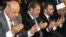 Egyptian Vice President, Mahmoud Mekki, left, President Mohammed Morsi, second left, Prime Minister Hesham Kandil, third left, and the Grand Sheik of Al-Azhar, Ahmed el-Tayeb, right, attend Eid al-Fitr prayers to mark the start of a three-day Muslim holiday that signals the end of the holy month of Ramadan, Aug. 19, 2012. 