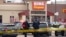 Police stand outside a King Soopers grocery store where a shooting took place, Monday, March 22, 2021, in Boulder, Colo. (AP Photo/David Zalubowski)