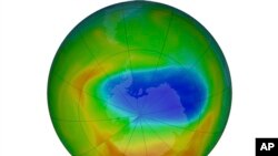 FILE - This NASA image shows a map of a hole in the ozone layer over Antarctica, Oct. 20, 2019. The purple and blue colors indicate the least amount of ozone, and the yellows and reds show the most. A far smaller hole has now opened over the Arctic.