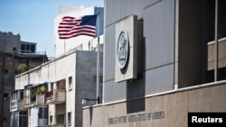 FILE - A flag flutters outside the U.S. embassy in Tel Aviv August 4, 2013.