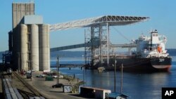 A bulk carrier ship is loaded, May 10, 2019, at the Temco grain terminal at the Port of Tacoma in Tacoma, Wash. U.S. and Chinese negotiators resumed trade talks Friday under increasing pressure after President Donald Trump raised tariffs on $200 billion in Chinese goods.