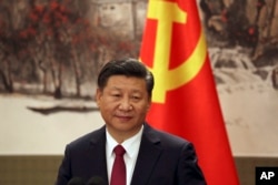 Chinese President Xi Jinping, one of the seven newly elected members of the Politburo Standing Committee, attends a press event at Beijing's Great Hall of the People on Oct. 25, 2017.