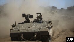 Israeli soldiers manuever a tank during a military exercise in the northern part of the Israeli-annexed Golan Heights on Sept. 7, 2017. Syria said Israeli airstrikes hit a facility in the country's west linked by Western nations to Syria's chemical weapons program.