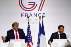 FILE - U.S. President Donald Trump speaks during a joint press conference with his French counterpart Emmanuel Macron at the G-7 summit in Biarritz, southwestern France, Aug. 26, 2019.