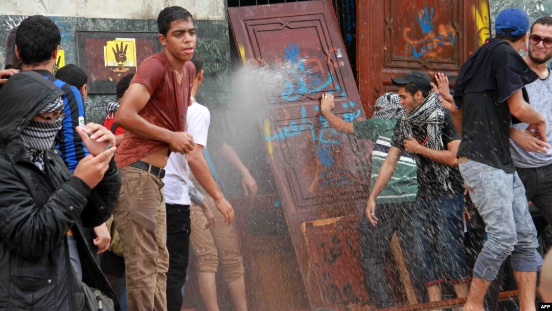 Egyptian students of al-Azhar University block the access to an administrative building during an anti-army protest in Cairo October 30, 2013.