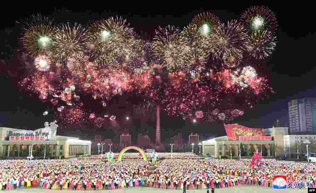 Young students celebrate the birthday of their country&#39;s founder and Eternal President Kim Il Sung, at Kim Il Sung Square in Pyongyang, in this photo taken April 15, 2021, and released from North Korea&#39;s official Korean Central News Agency on April 16.