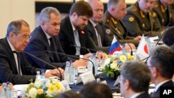 Russian Foreign Minister Sergei Lavrov (L) and Defense Minister Sergei Shoigu (2nd-L) attend a meeting with Japanese Foreign Minister Taro Kono and Defense Minister Takeshi Iwaya at the Iikura guest house in Tokyo, May 30, 2019. 