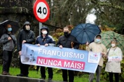 People demonstrate outside Pazo de Meiras, former Spanish dictator Francisco Franco's summer palace, which is being handed over by Franco's heirs to the Spanish state in Sada, northwestern Spain, Dec. 10, 2020.