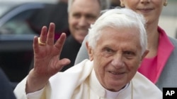 Pope Benedict XVI waves after his arrival at Tegel airport in Berlin, Germany, Thursday, Sept. 22, 2011.