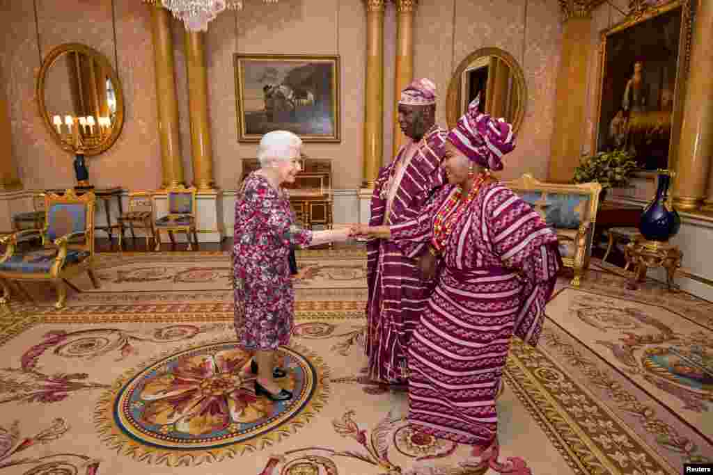 Britain's Queen Elizabeth meets George Adesola Oguntade, the High Commissioner of the Federal Republic of Nigeria, and his wife, Mrs. Oguntade, as Oguntade presents his Letter of Credence, during a private audience at Buckingham Palace in London.