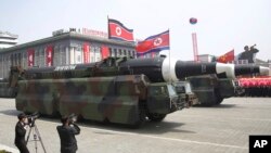 FILE - In this April 15, 2017, file photo, what analysts believe could be the North Korean Hwasong 12 is paraded across Kim Il Sung Square during a military parade in Pyongyang, North Korea. 