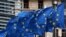 FILE - An EU flag flutters in the wind.