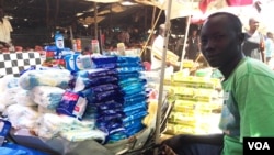 Santino Sworo, a 28-year-old South Sudanese trader, has sold household goods at the Nyakuron market in Juba for two years. December 6, 2016. (Jill Craig / VOA) 