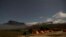 Mt. Kukenan (L) and Mt. Roraima are seen from the Tec Camp, near Venezuela's border with Brazil, Jan. 14, 2015.