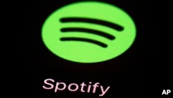 FILE: FILE- The Spotify app on an iPad. The music streaming service says it's cutting 6% of its workforce, becoming yet another tech company resorting to layoffs as the economic outlook worsens. CEO Daniel Ek announced the restructuring on Monday, Jan. 23, 2023.