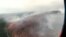 FILE - This image made from video provided by RU-RTR Russian television channel shows a view of a forest fire in the Boguchansky district of the Krasnoyarsk region, Russia Far East, July 31, 2019. 