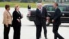 U.S. Rep.Brenda Lawrence, U.S. Sen. Debbie Stabenow, and Gov. Rick Snyder greet President Obama as he arrives at the Bishop International Airport in Air Force One for a visit to Northwestern High School in Flint, Mich., May 4, 2016. 