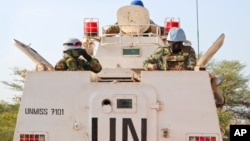 FILE - Highway attacks in South Sudan aren't a new issue. Here, U.N. peacekeepers lead a patrol from Bentiu toward Nhialdiu, part of an increase in patrols.