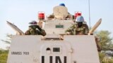 FILE - Highway attacks in South Sudan aren't a new issue. Here, U.N. peacekeepers lead a patrol from Bentiu toward Nhialdiu, part of an increase in patrols after an increase of reports of violent attacks on roads, Dec. 7, 2018.