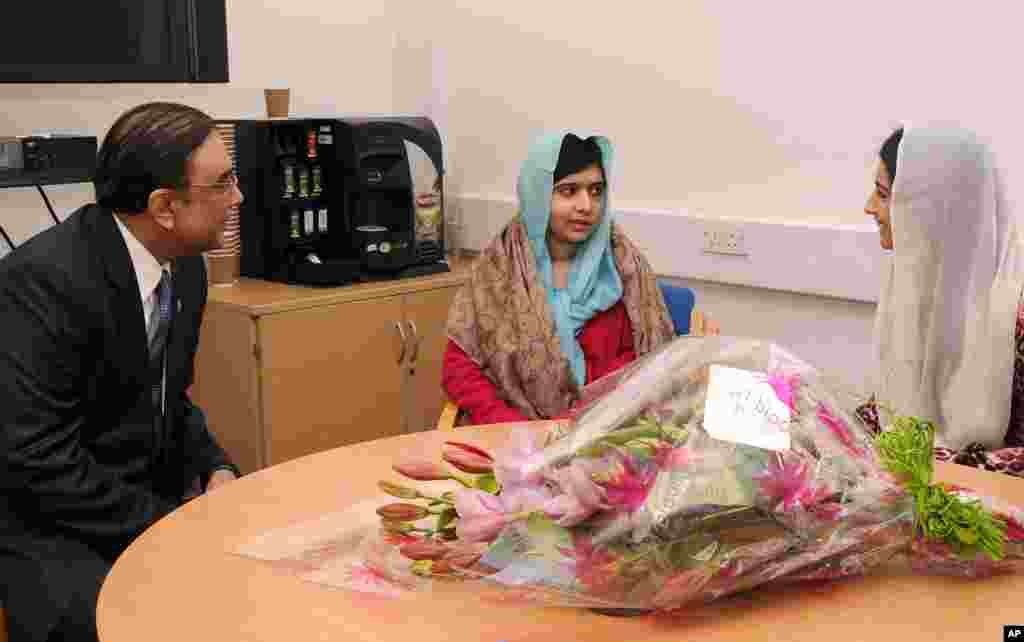 This photo provided by the Queen Elizabeth Hospital Birmingham shows Pakistan's President Asif Ali Zardari, and his daughter Asifa Bhutto, right, meeting with Malala Yousafzai at the hospital, December 8, 2012. 
